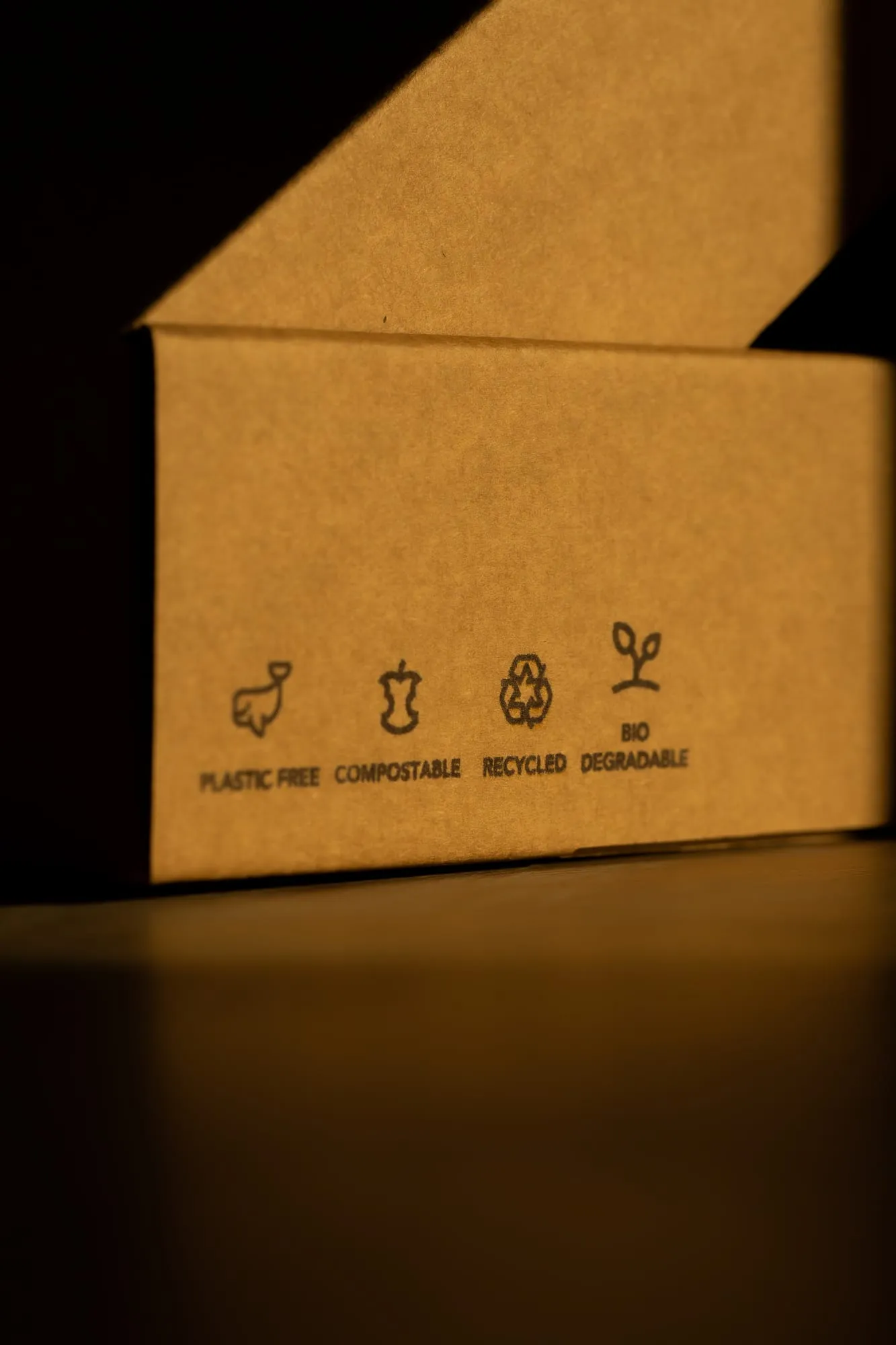 A corrugated shipping box in low light